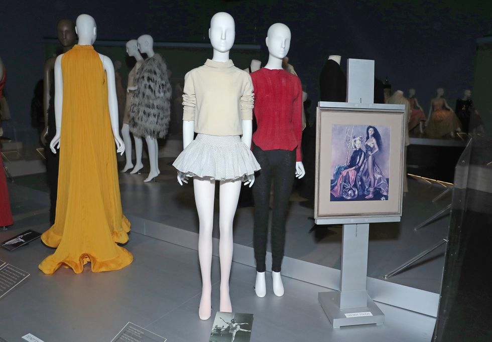 Exhibit photo of two mannequins wearing vintage practicewear.