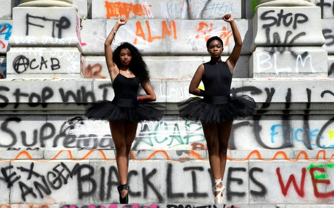 Meet Ava Holloway and Kennedy George, the Teens Whose Photo Dancing On a Confederate Statue Went Viral