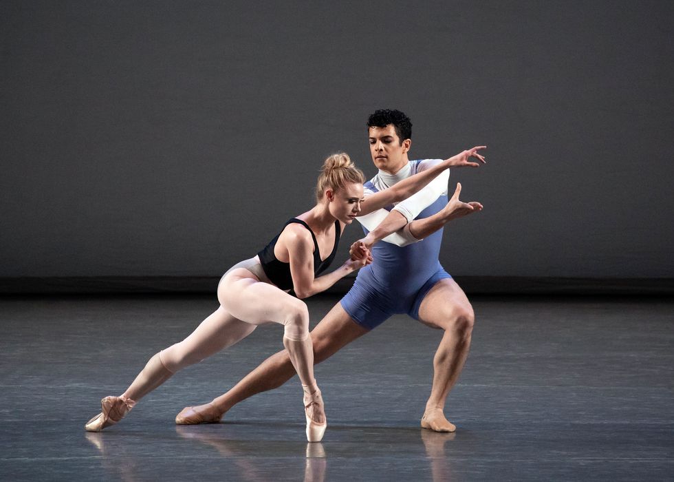 Sara Mearns in a deep lunge on pointe, supported by Gilbert Bolden