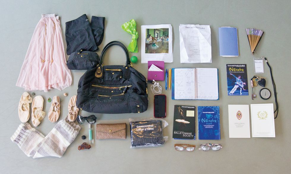 The contents of Julie Kent's dance bag, laid out geometrically on a dance studio floor