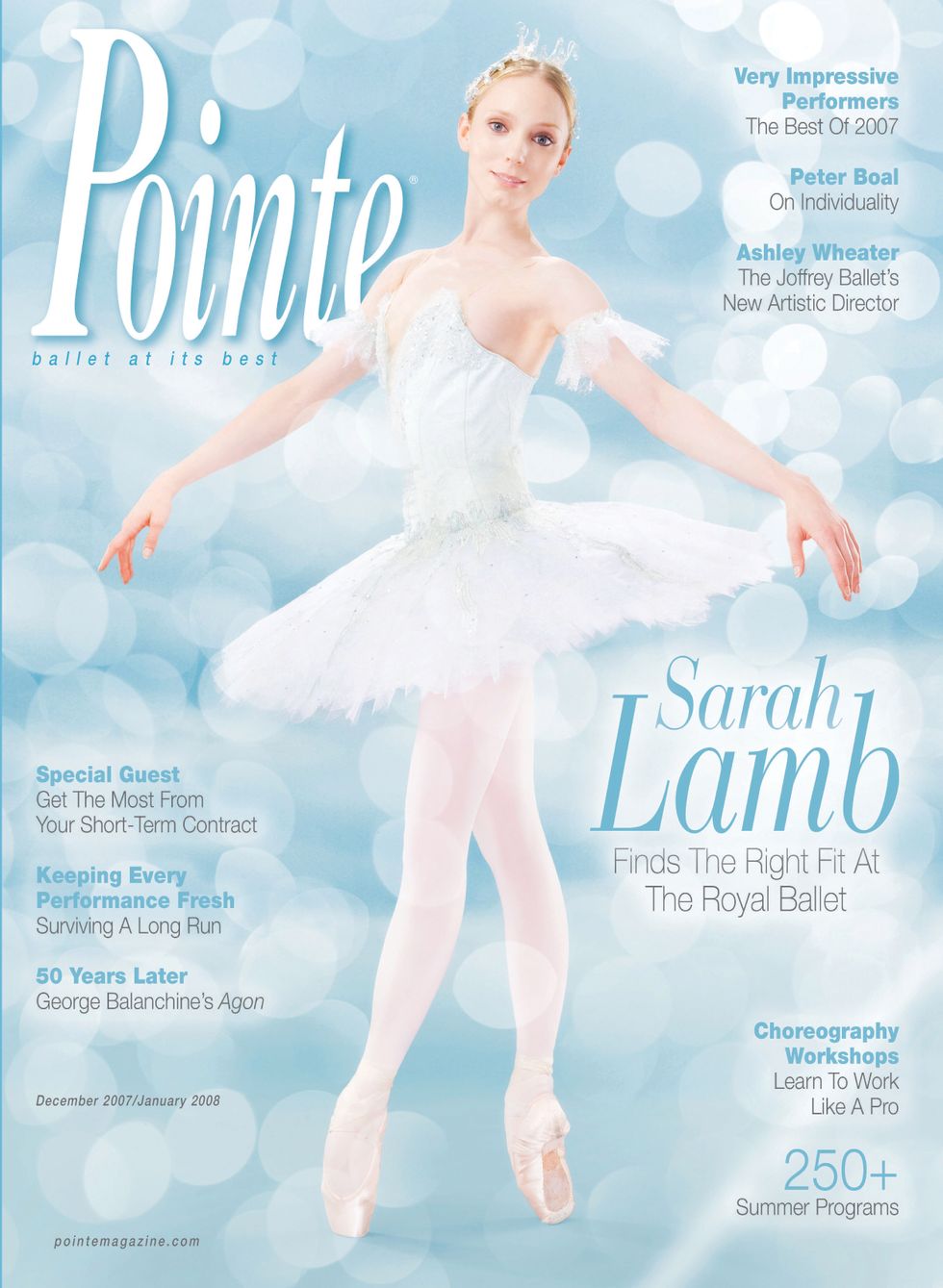 Sarah Lamb in a white tutu poses against a background of blue bubbles with white and blue text