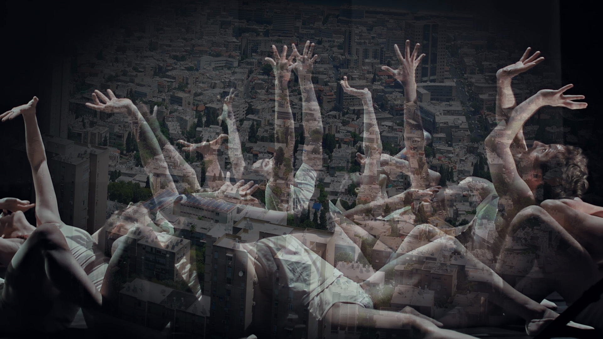A still from a documentary shows a transparent image of a group of dancers overlaid on an image of a gray cityscape. The dancers, male and females dress in minimalist white costumes, bend backwards as some reach with mangled fingers toward the sky.
