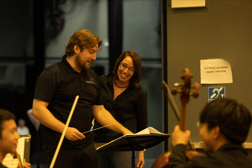 Matthew Kasper and Maria Simonetti laugh together as they review the score for "Raymonda" during a joint ballet-orchestra rehearsal.