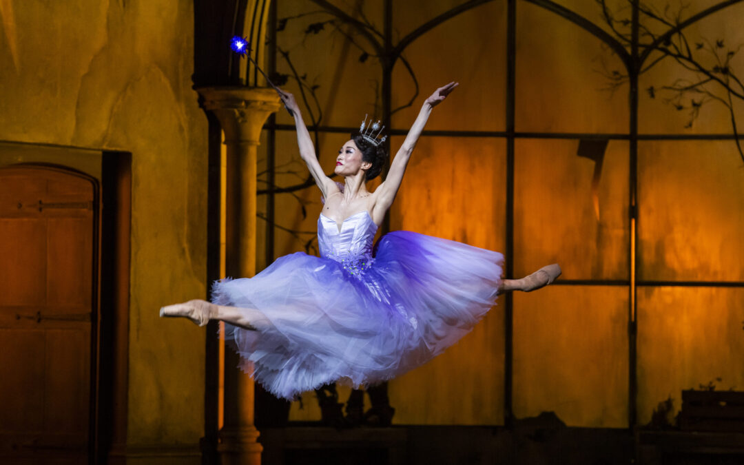 Fumi Kaneko flies through the air in a jubilant saut de chat as The Fairy Godmother in Cinderella.