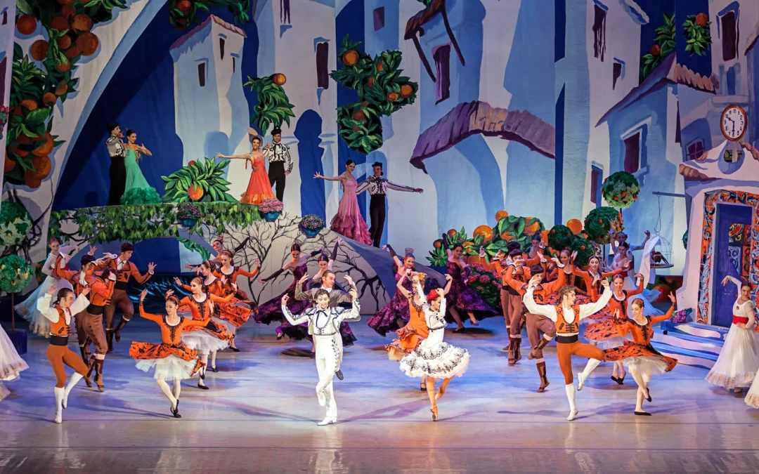 Onstage an elaborate set for a production of "Don Quixote," the National Ballet of Ukraine performs a lively ensemble dance.