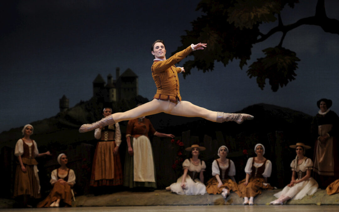 Luke Ingham does a lofty saut de chat onstage as he performs the role of Albrecht in "Giselle."