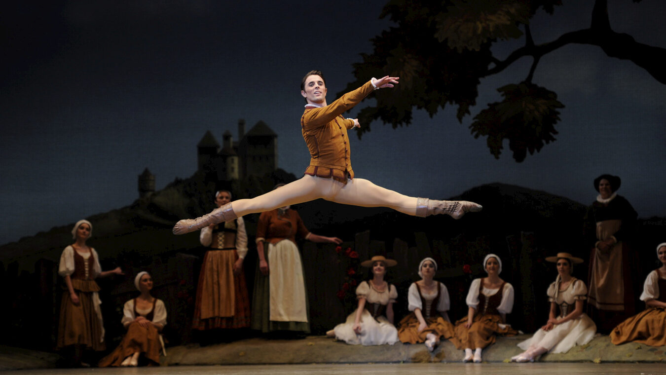 Luke Ingham does a lofty saut de chat onstage as he performs the role of Albrecht in "Giselle."