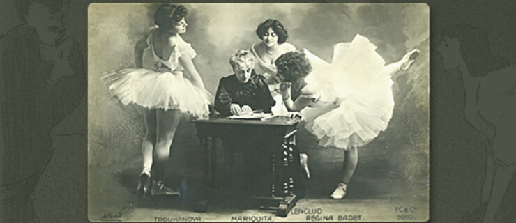 Portrait of the choreographer Madame Mariquita seated at a carved wooden desk. Three dancers surround her, wearing white tutus. They are Natalia Trouhanova (left), Marthe Lenclud (to Mariquita's rear) and on the right, Regina Badet, leaning over the desk with her left leg raised in an arabesque.