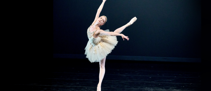 Sasha De Sola dances in George Balanchine's "Diamonds," standing in a beautiful arabesque croise on pointe.