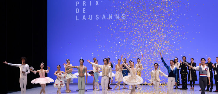 Onstage at the Prix de Lausanne, the nine winning dancers stand in a line downstage and bow, gold confetti raining down from above. Behind them, jury members and other competitors watch and clap. All the dancers wear the costumes in which they performed.