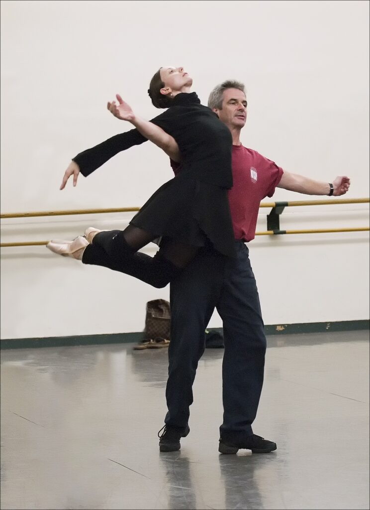 Jennifer Alexander is lifted by Kevin McKenzie in the studio as she arches and bends her legs backwards.