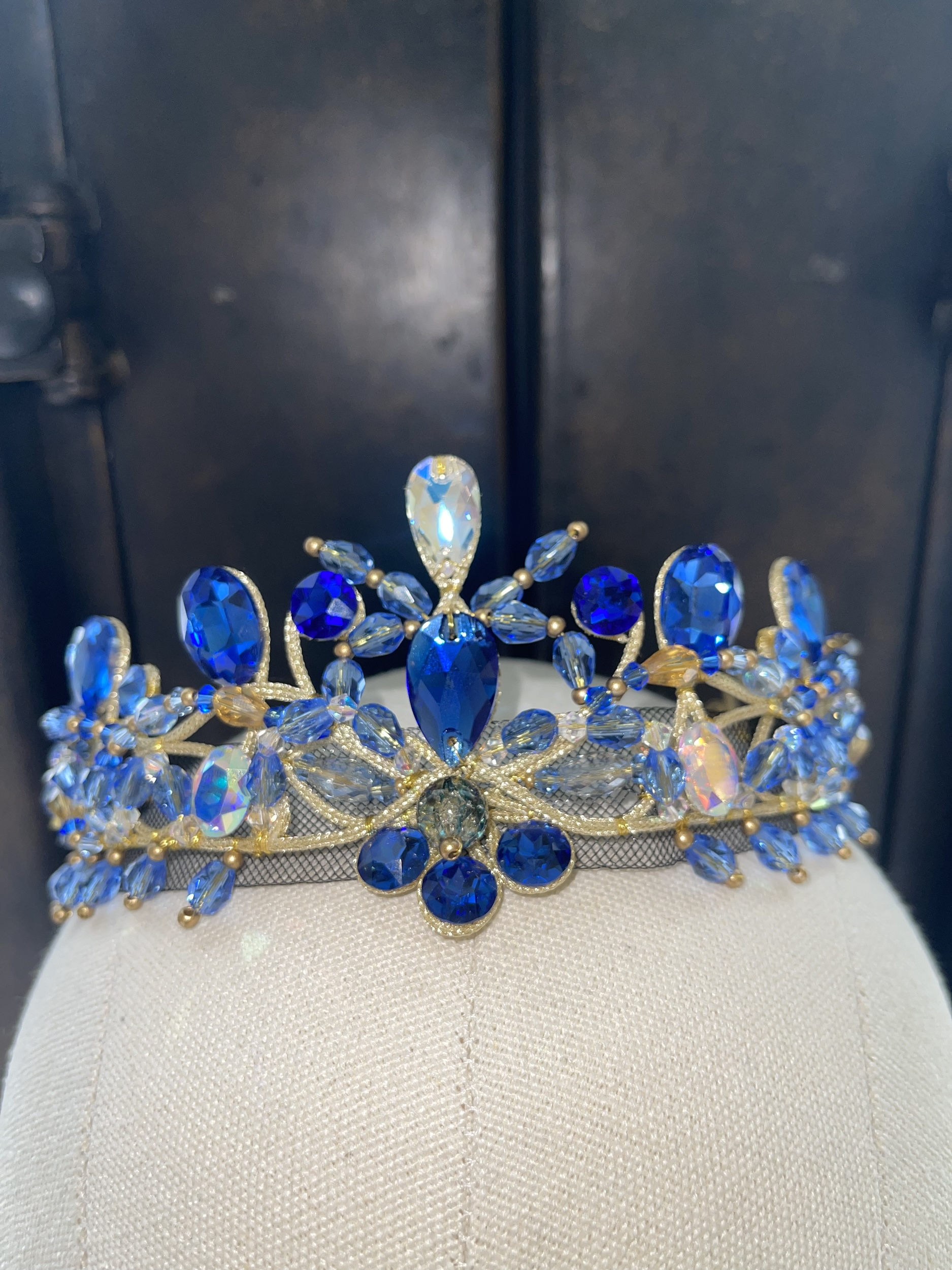 An image of a blue ballet costume tiara appears in the upper left corner