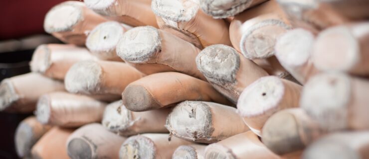 A pile of pointe shoes.