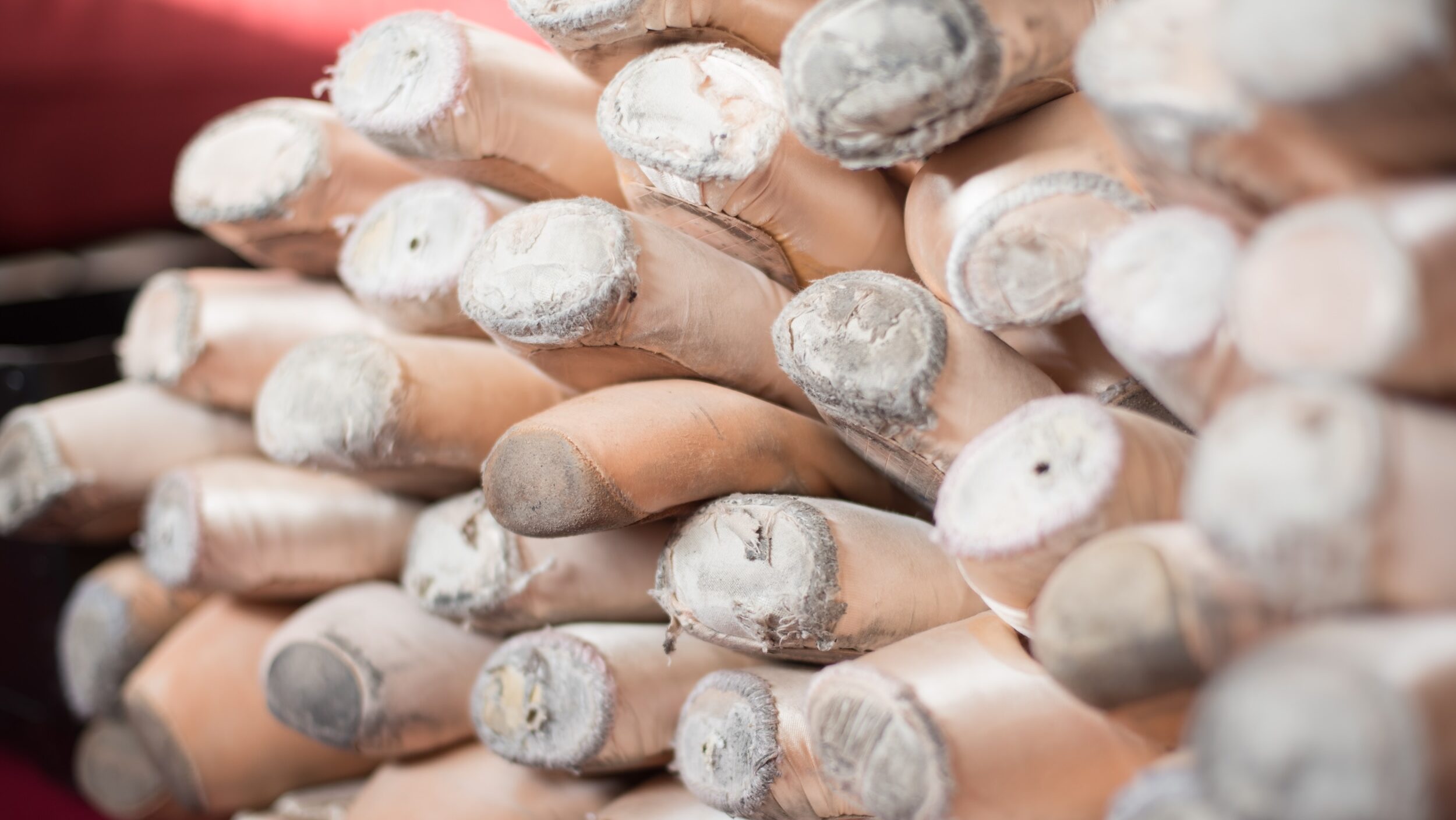 A pile of pointe shoes.